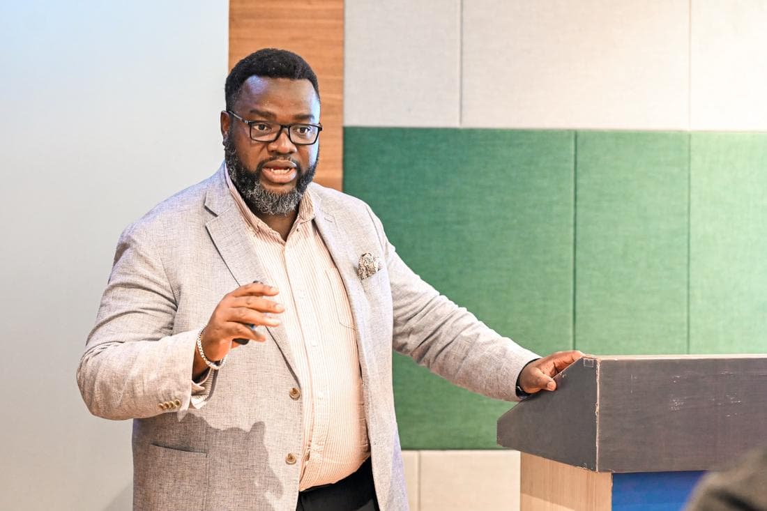 Victor Sonde speaking at a lectern